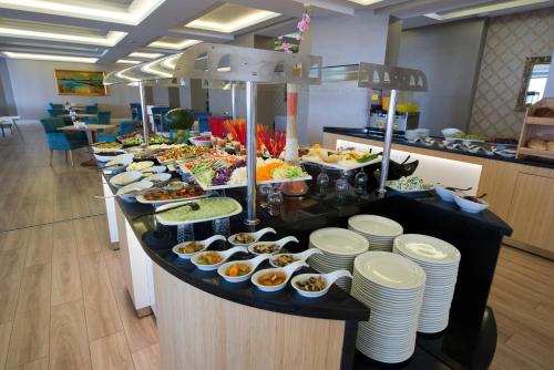 a buffet line with many different types of food at The Berussa Hotel in Bursa