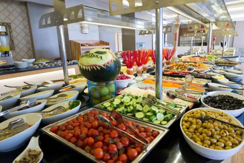 a buffet line with many different types of food at The Berussa Hotel in Bursa