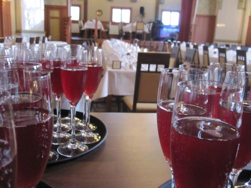a group of wine glasses sitting on a table at Hotelli-Ravintola Alma in Seinäjoki