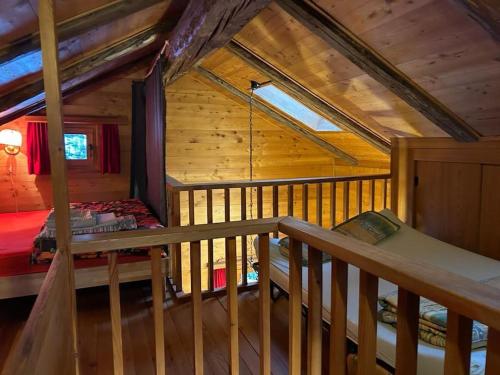 a view of a bedroom in a log cabin at Magnifique racard rénové isolé 10 minutes de marche in Haudères