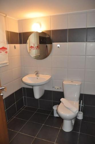a bathroom with a toilet and a sink at Niove Budget One-Bedroom Apartment in Paralimni