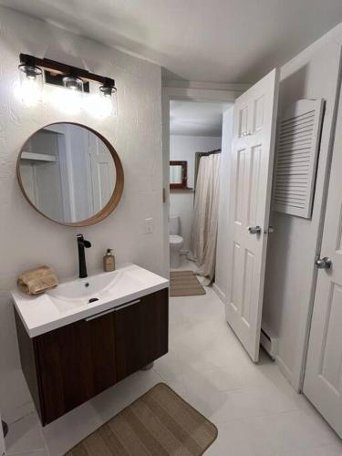 a bathroom with a sink and a mirror at Ski In, Ski Out Cozy Creek Side Cabin w Front Yard in Steamboat Springs