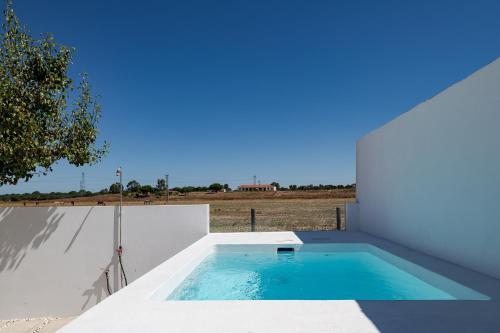 a swimming pool on the roof of a house at Casa Paraíso in Ferreira do Alentejo