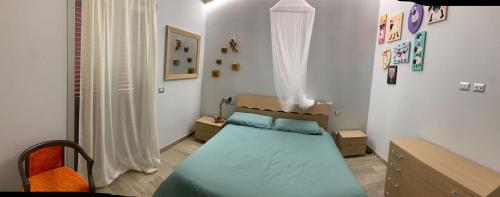a small bedroom with a bed and a window at Casacocco' - Agri Host in San Ginesio