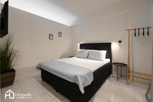 Postel nebo postele na pokoji v ubytování Agora Central Home