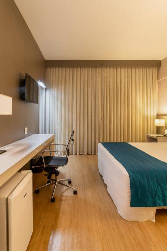 Ένα ή περισσότερα κρεβάτια σε δωμάτιο στο Suntory Hotel