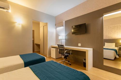 Ένα ή περισσότερα κρεβάτια σε δωμάτιο στο Suntory Hotel