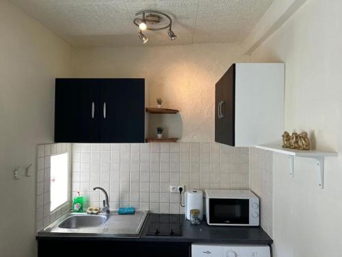 Kuchyň nebo kuchyňský kout v ubytování Nid douillet au cœur de Sens