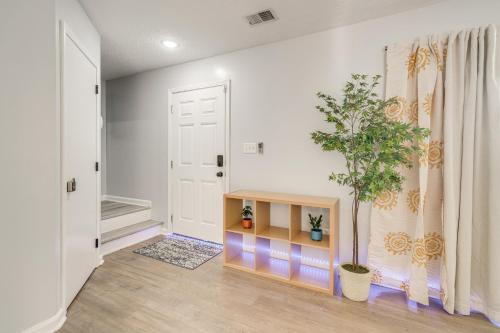 a room with a table and a potted plant at Louisville Home with Large Yard 15 Mi to Downtown! in Louisville