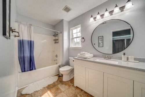 a bathroom with a sink toilet and a mirror at Louisville Home with Large Yard 15 Mi to Downtown! in Louisville