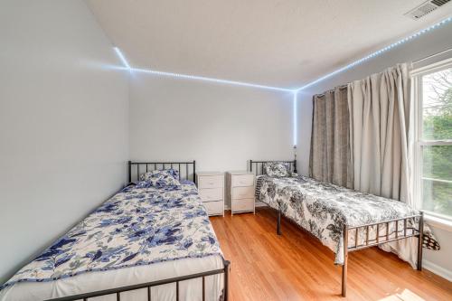 a bedroom with two beds and a window at Louisville Home with Large Yard 15 Mi to Downtown! in Louisville