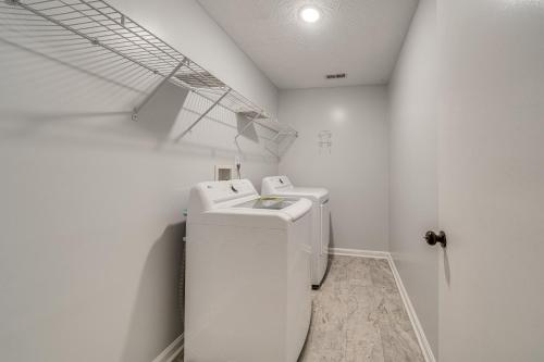 a white laundry room with a washer and dryer at Louisville Home with Large Yard 15 Mi to Downtown! in Louisville