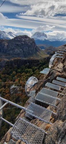 a bunch of solar panels on the side of a mountain at OVO Patagonia in El Chalten