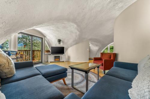 a living room with a couch and a table at The Iconic Vail Ski Dome, Free parking for skiers! in Vail