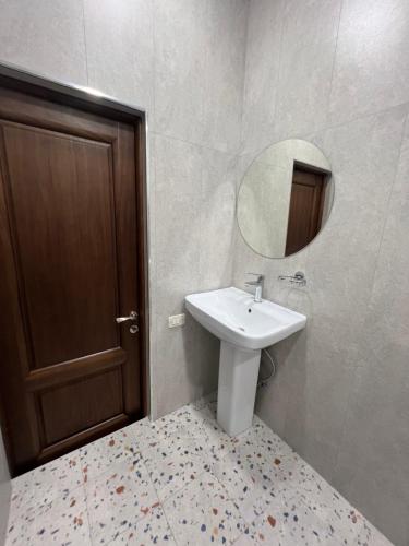 a bathroom with a sink and a mirror at Velvet Vouge Hostel in Yerevan