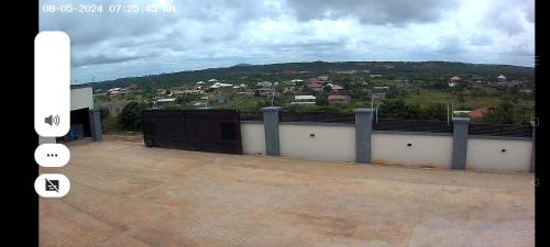 a balcony with a view of a city at Purple Springs Elmina #1 in Esamang