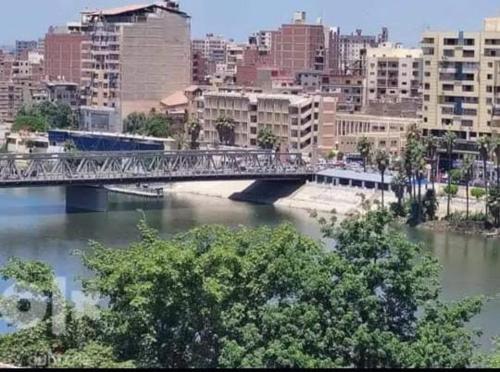 a bridge over a river in a city at لم تعد الشقه متوفره برجاء عدم الحجز لا استطيع ازاله الاعلان او التواصل مع الدعم in Mansoura