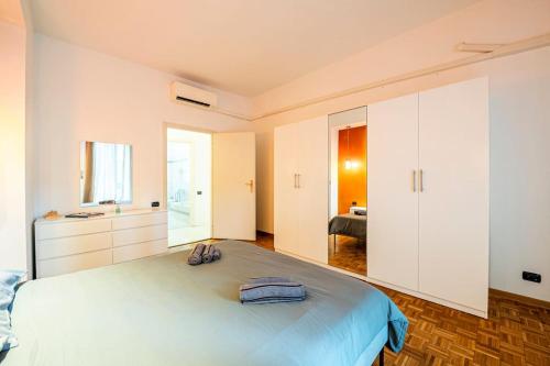 a bedroom with a large bed with towels on it at Tranvia Federiga - Appartamento con Doppio Balcone in Florence