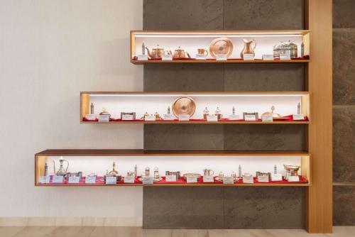a display case in a store filled with figurines at Ramada by Wyndham Diyarbakir in Diyarbakır