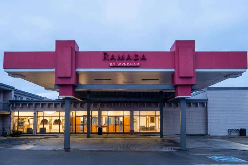 a building with a sign that reads karamara university at Ramada by Wyndham Thunder Bay Airlane Hotel in Thunder Bay