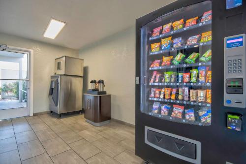 a soda vending machine in a store with drinks at Studio 6 Albuquerque NM Midtown in Albuquerque