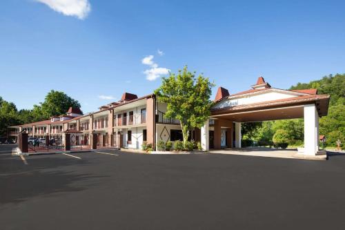 an empty parking lot in front of a building at Days Inn by Wyndham Helen in Helen