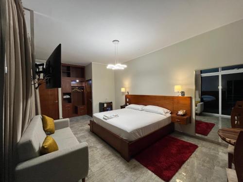 Un ou plusieurs lits dans un hébergement de l'établissement Caruzo Hotel and suites