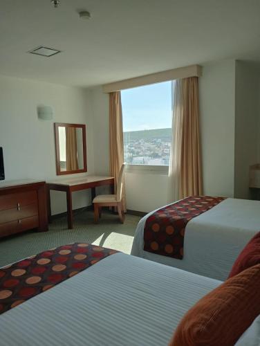 Ένα ή περισσότερα κρεβάτια σε δωμάτιο στο Hotel Ankara "Las Lomas"