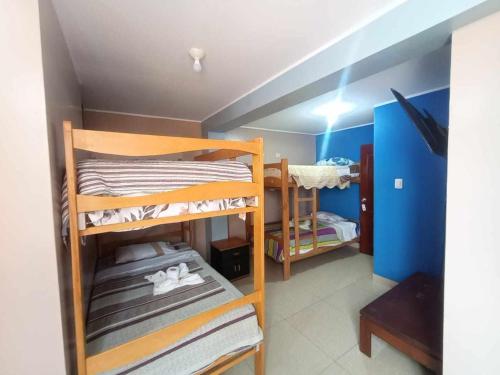 Postel nebo postele na pokoji v ubytování Hostal Milagros