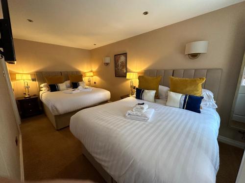Letto o letti in una camera di The Chester Court Hotel