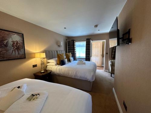 Letto o letti in una camera di The Chester Court Hotel