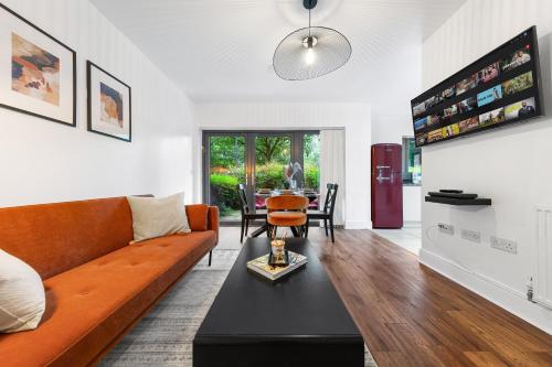 a living room with a couch and a table at Modern 2 Bedroom Apartment in Uxbridge London free parking in London