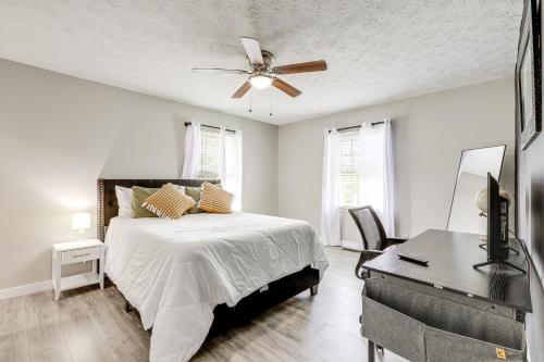 a bedroom with a bed and a ceiling fan at 18 Mi to Dtwn Atlanta Pet-Friendly Home with Yard! in Union City