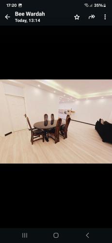 two chairs and a table in a room at Avenue soleil sur mer flic en flac in Flic-en-Flac