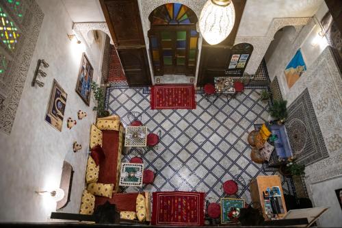 an overhead view of a living room with red furniture at Dar Lalamoune in Fès