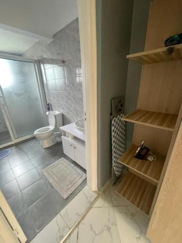 a bathroom with a toilet and a sink at Mavana Cottages in Ol Pejeta Conservancy