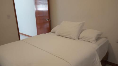 Postel nebo postele na pokoji v ubytování Orizaba Suites