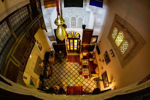 an overhead view of a living room with a staircase at Dar Lalamoune in Fès