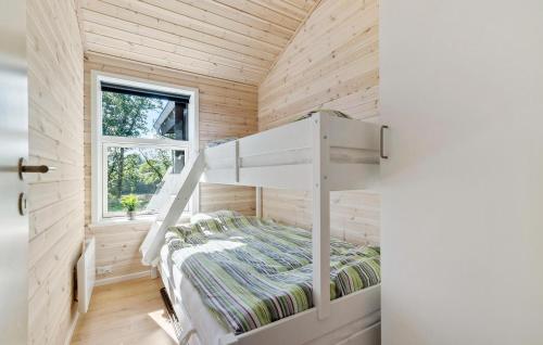 a bunk bed in a tiny house at 3 Bedroom Cozy Home In Ejstrupholm in Krejbjerg