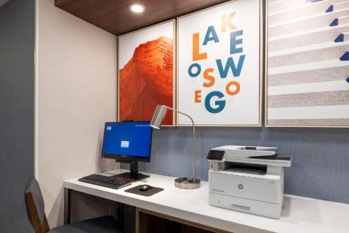 an office with a desk with a computer and a printer at Holiday Inn Express Portland South - Lake Oswego by IHG in Lake Oswego