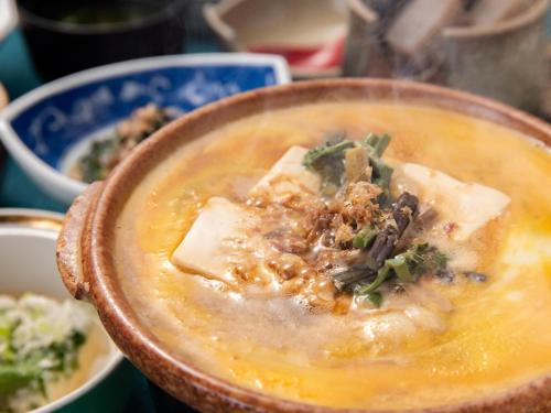 a bowl of soup with some food in it at Togakubo in Isehara