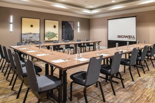 a large conference room with a long table and chairs at The Bidwell Marriott Portland in Portland