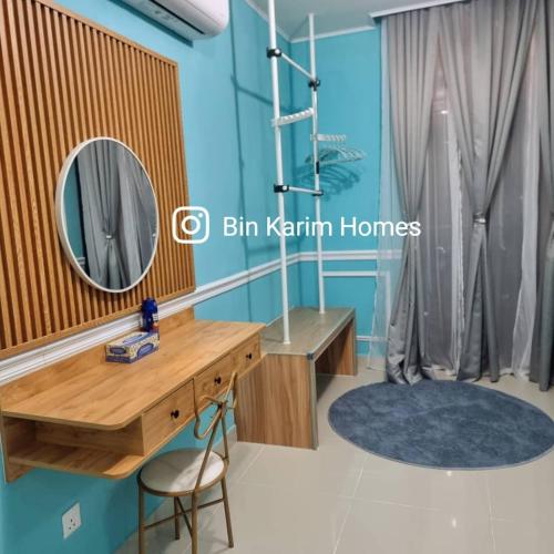 a dressing table and mirror in a room at The Shore KK by Bin Karim Homes in Kota Kinabalu