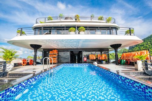 a cruise ship with a pool on the deck at Venus Cruises Halong Bay in Ha Long