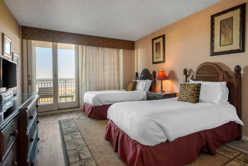 Ένα ή περισσότερα κρεβάτια σε δωμάτιο στο Villas Of Amelia Island