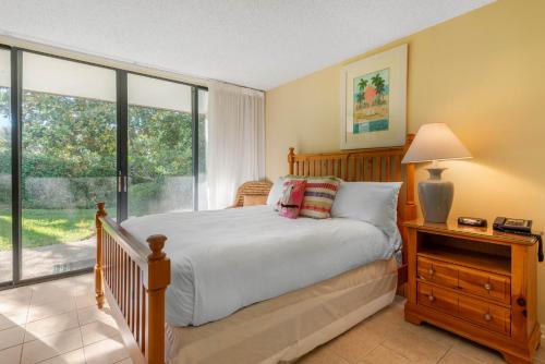 Ένα ή περισσότερα κρεβάτια σε δωμάτιο στο Villas Of Amelia Island