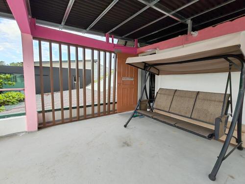 a bunk bed in a room with a large window at Sunset Seaview Bay Villa in Putatan