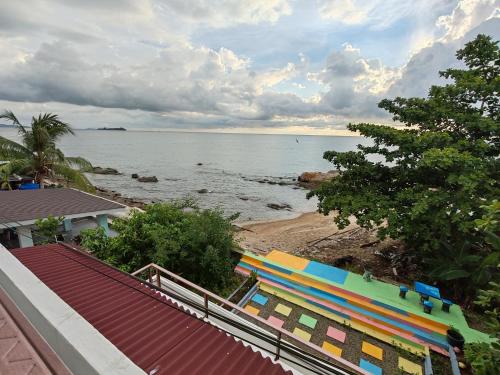 a view of the ocean from a house at Sunset Seaview Bay Villa in Putatan
