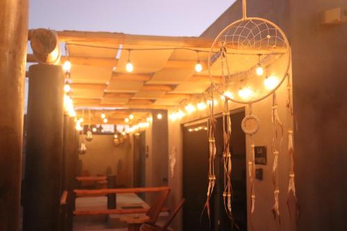 a room with lights hanging from a ceiling at Las 3 Carabelas BCS in El Sargento