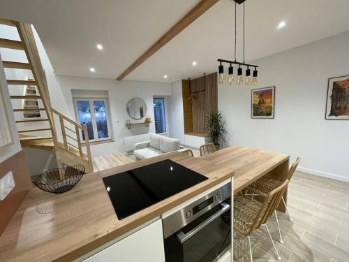 a kitchen with a wooden counter top in a room at Maison indépendante avec jardin in Orvault